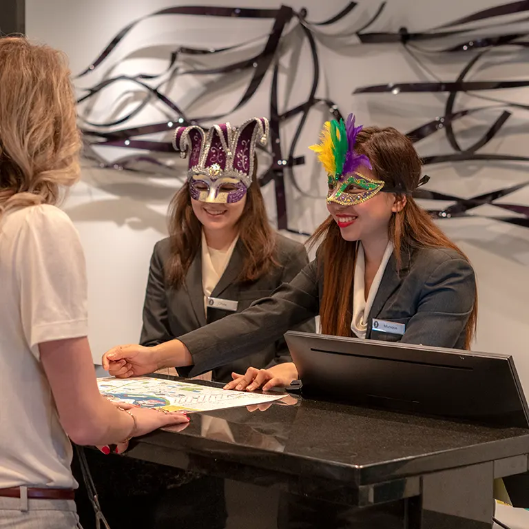 jung hotel staff dressed for mardi gras